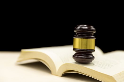 judges gavel book wooden table law justice concept background