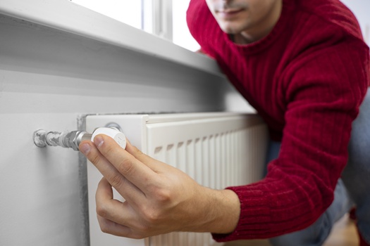 close up man using rotary switch