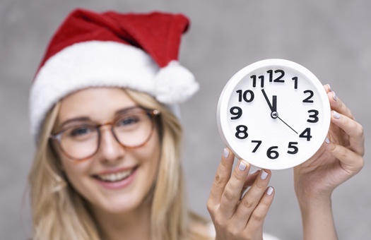 close up smiley woman with clock
