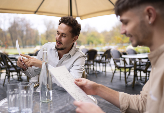 side view men sitting restaurant