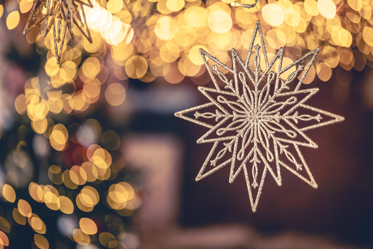 Christmas background with decorative star and bokeh lights. Greeting card design. Copy space.