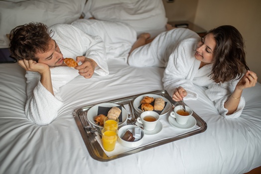 breakfast bed with couple having breakfast