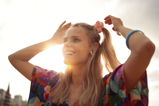 woman enjoying 80s summer aesthetics